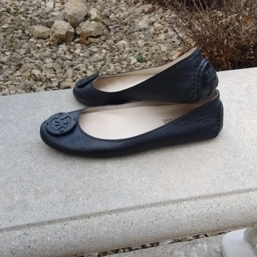 Michael Kors black leather flats with MK logo. Size 7.5